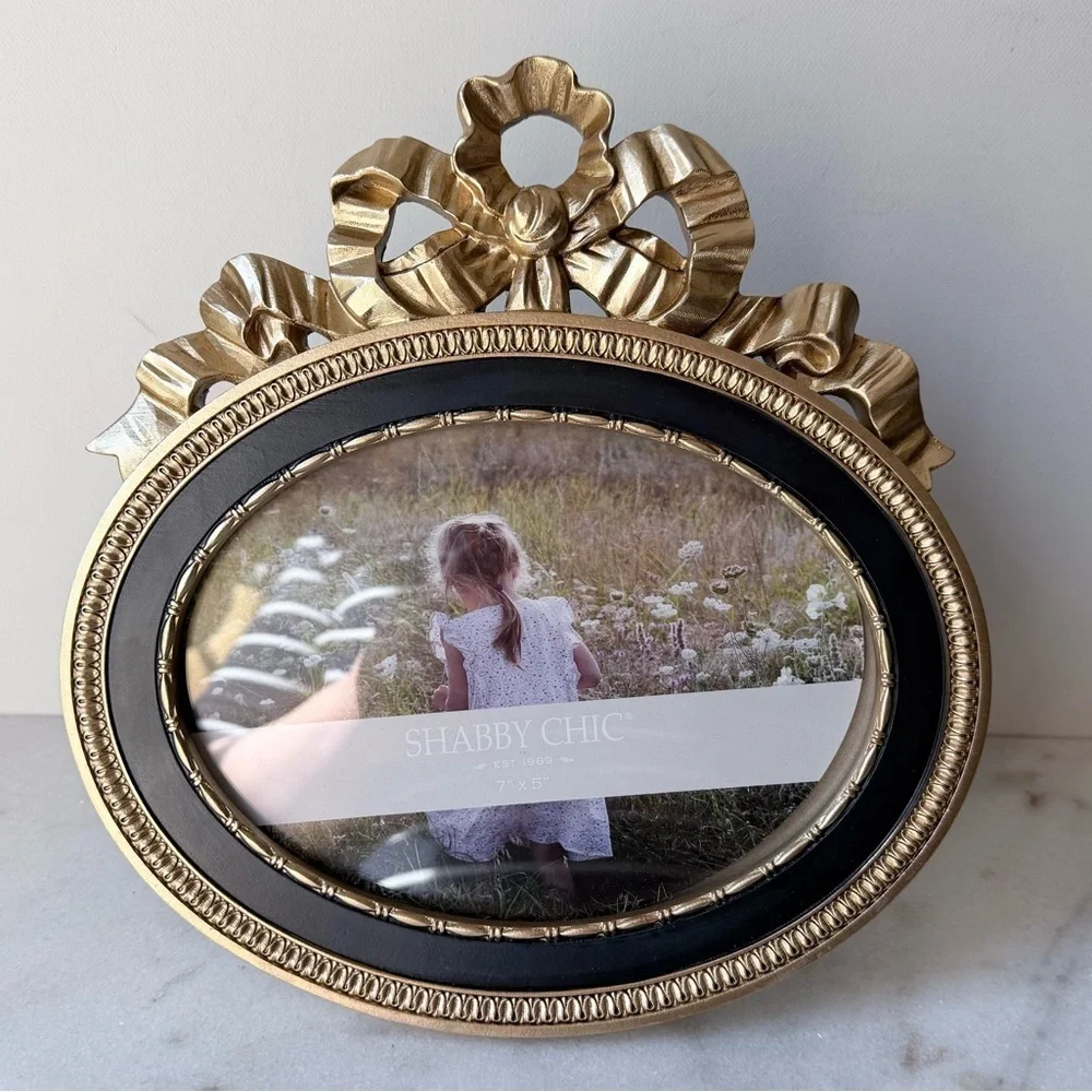 Ornate Oval Gold Photo Frame with Black Trim bow on top 7”x5”